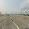 Car stopped on Q Bridge with passengers fleeing