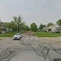 Blind man walking in middle of Jefferson Street