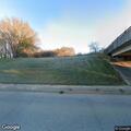 Animal lying in roadway on bridge