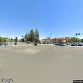 Passenger trips boarding stopped bus at Stevens Creek and De Anza