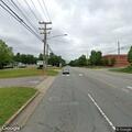 Man walking barefoot in roadway on Cox Road