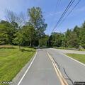 Tree on power lines causes small roadside fire