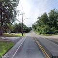 Driver reported for running red light at intersection
