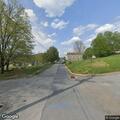Officer stops yellow sedan at intersection