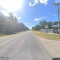 Elderly woman with walker near disabled vehicle on County Road Z