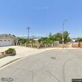 Person conscious and breathing on sidewalk at Baldwin Park
