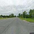 Two-vehicle crash with person on ground reported