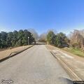 Truck loses lumber load and closes highway lane