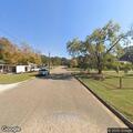 Woman holding head and crying at intersection in Prattville