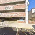 Three people stuck in elevator in parking garage