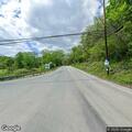Vehicle crash with debris and fluid on roadway