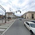 Unconscious homeless person breathing on street corner