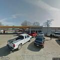 Man knocking on elderly woman’s window at Spruill Mart