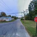 Person lying in middle of Ohio Street roadway
