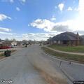 Man lying on ground, possibly intoxicated in Norman