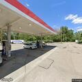 Traffic stop on black Lexus in gas station lot