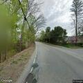 Adult male walking in roadway on Giles Road