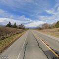 Loose dog running in roadway on State Highway 22