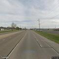 Traffic stop for unsafe load on red truck tractor