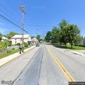 Motorcycle fire and fuel leak on Main Street