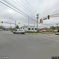 Man walking in traffic lanes near Route 23 and 94