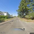 Person walking in middle of turning lane