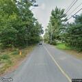 Tree truck blocking lane and causing traffic hazard