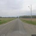 Semi truck in ditch partially blocking roadway