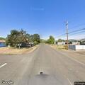 Suspicious pair pushing motorcycle with bags of cans