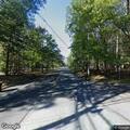Tree leaning on power lines at Round Top intersection