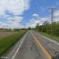 Delivery truck hits pole, causing property damage
