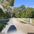 Two trucks crash near tree line on Morris Avenue