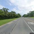 Person lying in middle of road in Libertyville