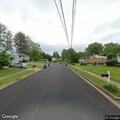 Man screaming on roadside near shopping center
