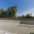 Man standing on highway 99 off-ramp railing