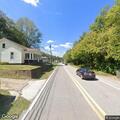 Man stopping cars near racetrack in Pennsboro
