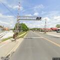 Vehicle hits railroad crossing arm and leaves scene