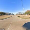 Traffic stop on red Infiniti SUV near highway