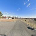 Woman walking in roadway near Icard intersection