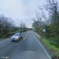 Fallen trees and power lines block roadway