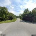 Elderly woman walking in roadway near Boy Scout and Sterling