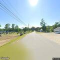 Male bicyclist acting distressed near boat landing