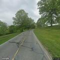 Broken utility pole and lines blocking College Drive