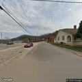 Gasoline spill in garage under house on School St