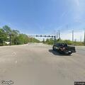 Person lying injured on sidewalk at Innovation Way South