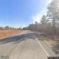 Unlit vehicle stopped in middle of Clinton Road