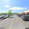 Traffic stop on black Toyota Camry near outlet