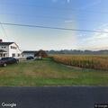 Structure and field fire reported on County Road