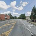 Woman clipped by vehicle while walking on street