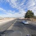 Disabled car on shoulder blocking safe tire change
